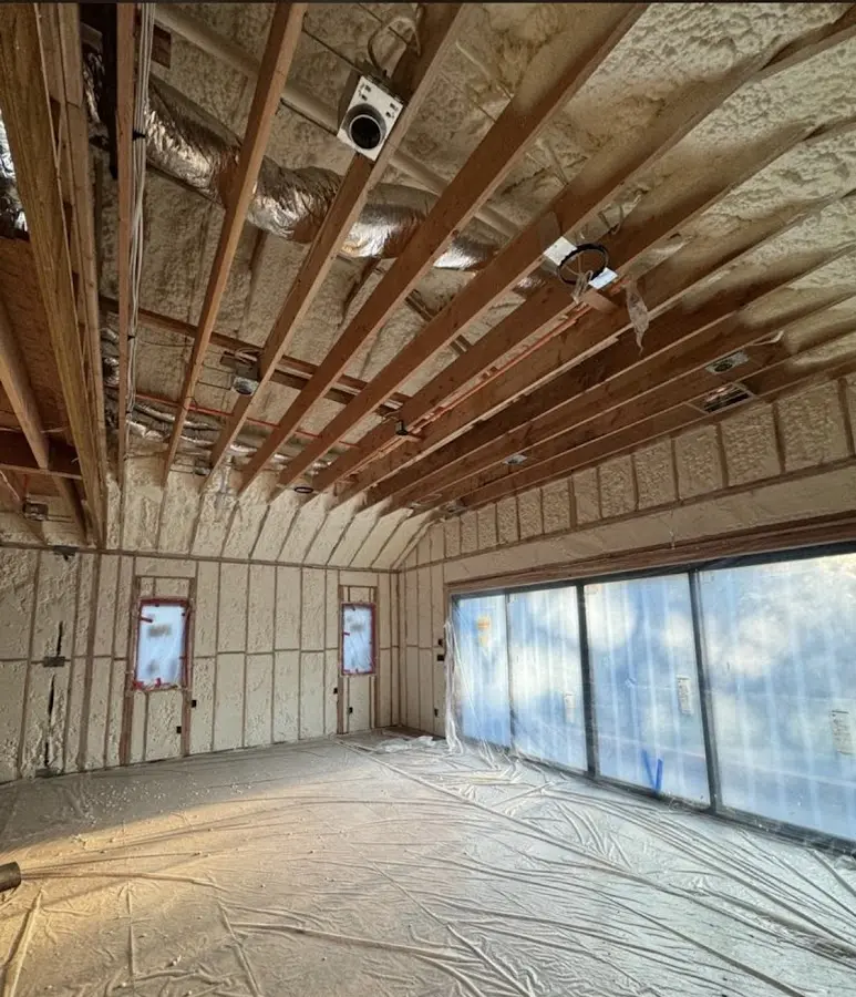 Interior walls and ceiling insulated with spray foam during new construction in Thetford